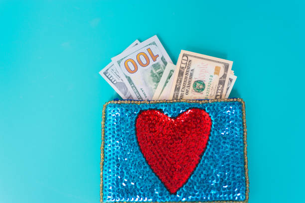 istock Dollar Bills in Glittery Change Purse with Heart 1069021066