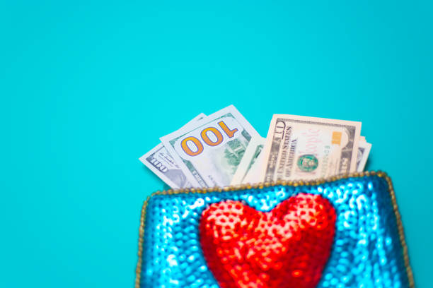 istock Dollar Bills in Glittery Change Purse with Heart 1069021164