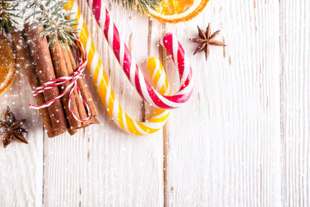 istock Christmas background with Candy canes and cinnamon sticks 1069026550