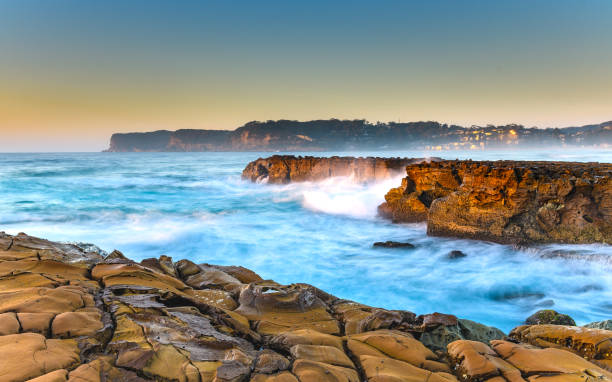 Sunrise Headland Seascape Capturing the sunrise from North Avoca Beach on the Central Coast, NSW, Australia. avoca beach photos stock pictures, royalty-free photos & images