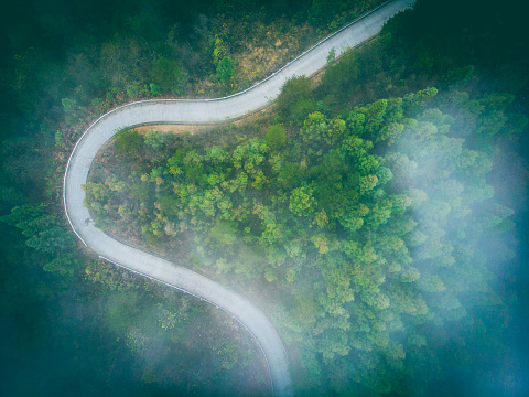 Aerial view mountain road with fog