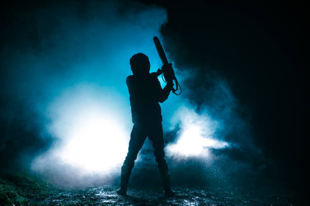 I will kill you Man holding chainsaw at night creepy stalker stock pictures, royalty-free photos & images