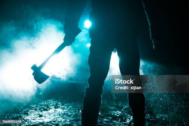 Man Holding Axe Standing In Front Of Car Stock Photo - Download Image Now - Murderer, Axe, Chasing