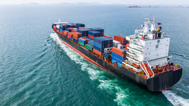 istock Aerial view cargo container ship sailing, container cargo ship in import export and business logistic and transportation of international by container ship in the open sea. 1069034830
