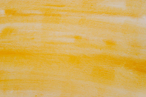 istock yellow watercolor painted background texture 1069038382
