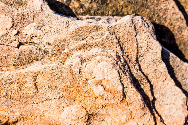 istock Close up of natural stone wall. Stone wall texture 1069039546