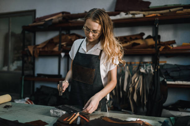 istock Woman working in the leather design workshop 1069045390
