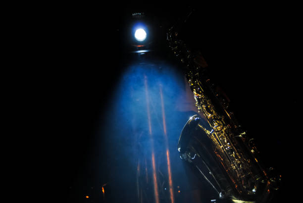 istock illuminated sax with focus and smoke 1069045474