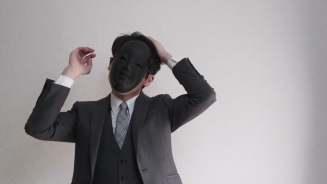 4k video of strange masked businessman who getting himself ready