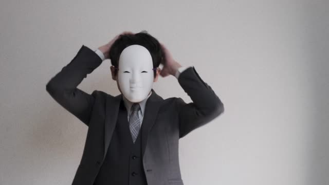 4k video of strange masked businessman who getting himself ready