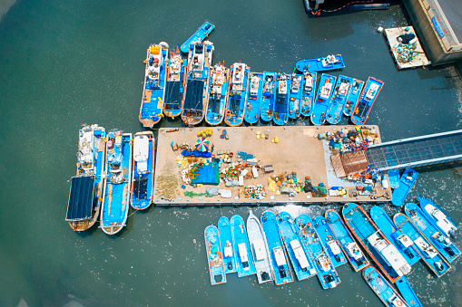 top view to fishing boats in harbor