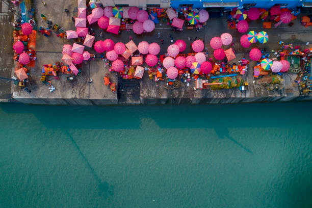 istock People and colorful umbrellas on fish market 1069060340