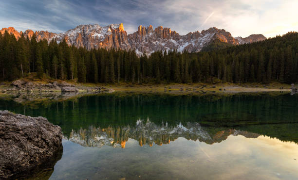 istock Sunset at Carezza lake with beautiful reflections of dolomites mountains 1069062632