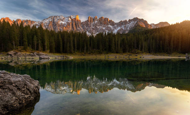 istock Sunset at Carezza lake with beautiful reflections of dolomites mountains 1069062634