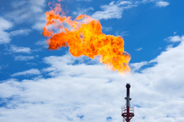 Gas flaring. Torch against the sky. Incineration of associated gas in oil production fumes stock pictures, royalty-free photos & images