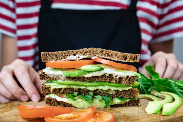 istock Delicious avocado sandwich on cutting board 1069081570