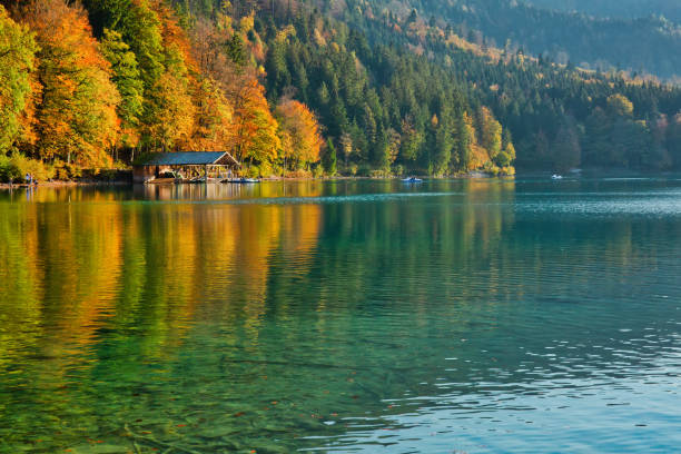 istock Beautiful blue mountain lake on a warm fall season day 1069083690