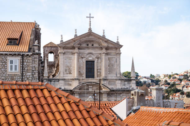 View over the roofs of Dubrovnik and church St. Stepan, Croatia View over the roofs of Dubrovnik and church St. Stepan with bell tower, Croatia fort minceta dubrovnik stock pictures, royalty-free photos & images