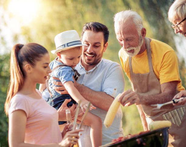 istock Family having a barbecue lunch in their garden 1069093748