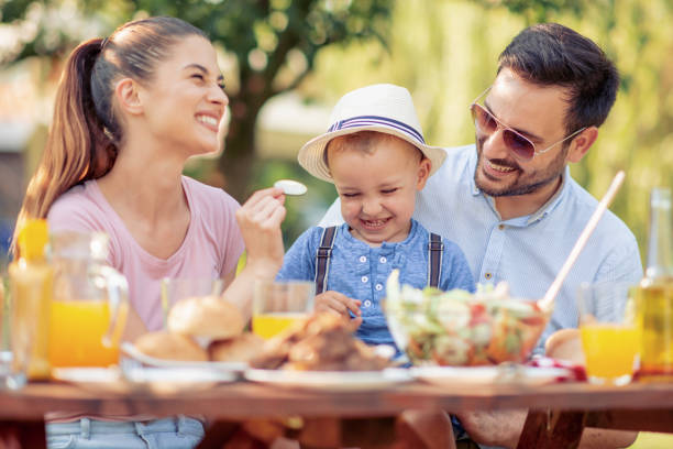 istock Family having a barbecue lunch in their garden 1069093798