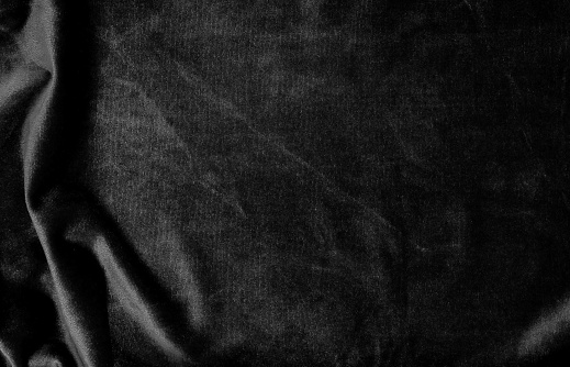 color de fondo negro de la textura de terciopelo. caro lujo, tela, tela, paño. Copia espacio. photo