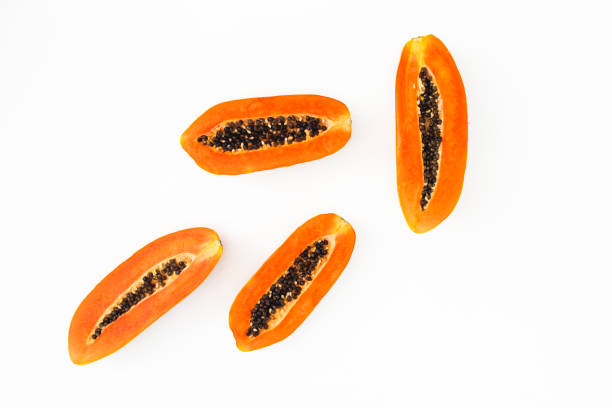 istock Slice of papaya on white background. Flat lay. Top view. Fruit concept 1069096112