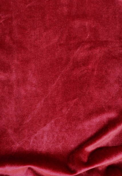 istock velvet texture background red color. Christmas festive baskground. expensive luxury, fabric, material, cloth.Copy space. 1069098464