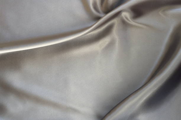 istock Fabric silk satin texture background silber color.Abstract background of luxury cloth wave. 1069100016