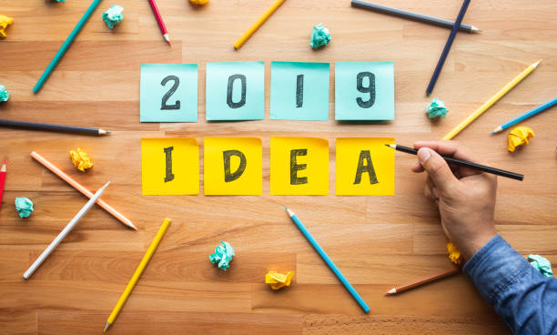 istock Business ideas 2019 with male hand Writing pencil on notepaper. 1069101864