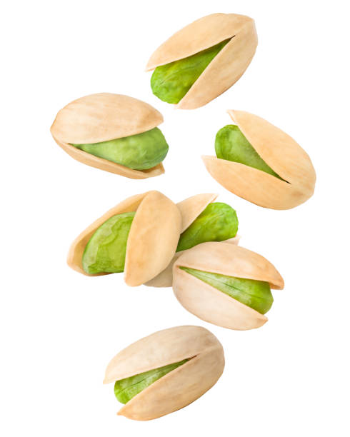 istock Falling pistachio isolated on white background, clipping path, full depth of field 1069106316