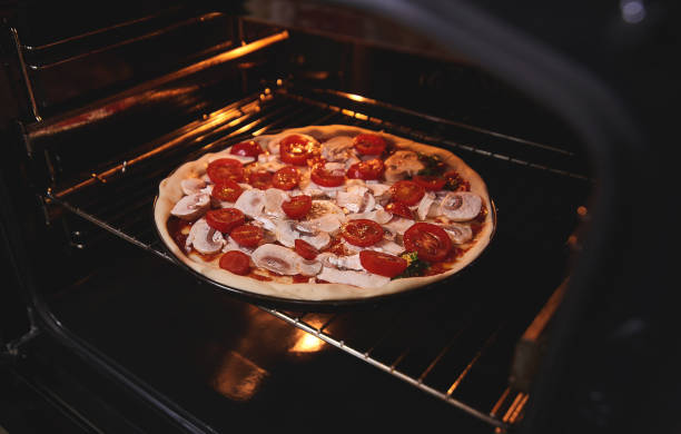 istock Pizza is inside the oven on the iron grill 1069106520