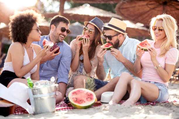 istock Young friends enjoying beach party 1069106794