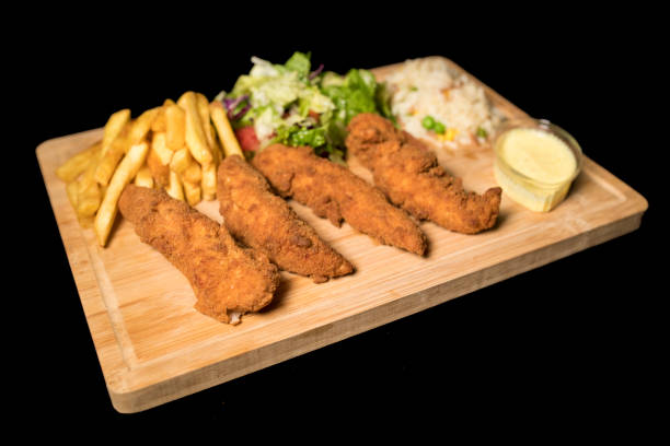 istock Chicken Goujons meal on wood 1069107422