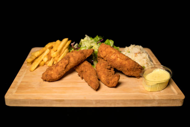 istock Chicken Goujons meal on wood 1069109044