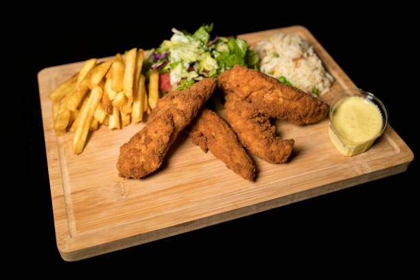 istock Chicken Goujons meal on wood 1069109246