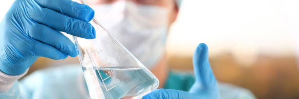 istock Male scientist hold in arm empty vials closeup 1069111986