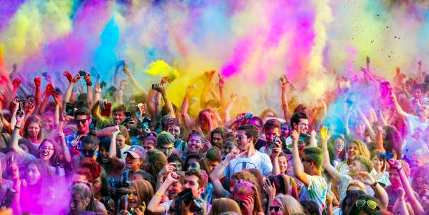 Happy young people dancing and celebrating during Music and Colors festival, close view stock photo