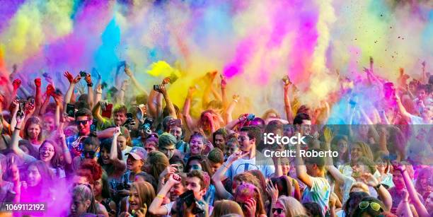 Happy Young People Dancing And Celebrating During Music And Colors Festival Close View Stock Photo - Download Image Now