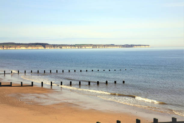 North bay, Bridlington, Yorkshire. Bridlington, Yorkshire, UK. April 22, 2015. The North beach and bay with Flamborough Head in the background at Bridlington in North Yorkshire, UK. east riding of yorkshire photos stock pictures, royalty-free photos & images