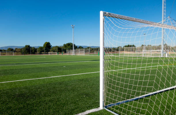 istock Football field in a sport complex 1069114436