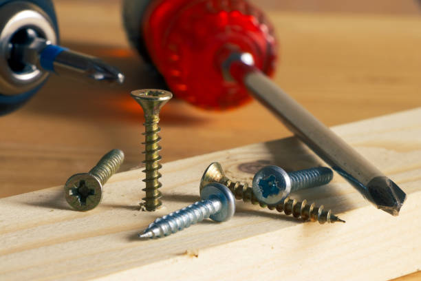 istock Screw being screwed into a wooden board 1069115626