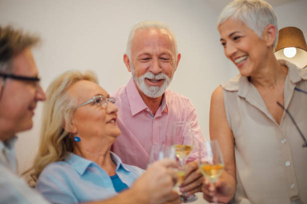 istock Smiling people having celebratory toast 1069115808