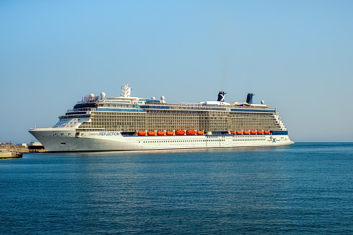 Malaga, Spain - June 25, 2018. Celebrity Reflection cruise ship owned and operated by Celebrity Cruises, docked at the port of Malaga city, Costa del Sol, Malaga Province, Andalucia, Spain, Western Europe