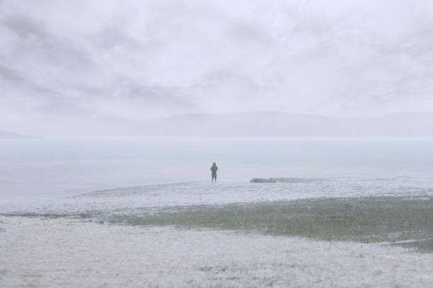 istock camping,man,rain,boat,lake,raincoat,rain Man,mystery,hidden 1069122456
