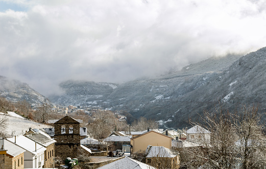 View of the snow-covered village of Robles de Laciana, Leon, Spain. Winter panorama, with mountains covered with snow.