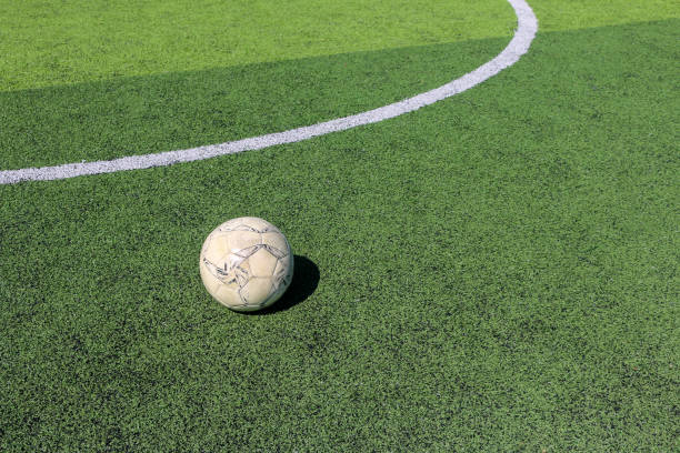 istock Football on artificial turf. It is for green background in a stadium 1069124080