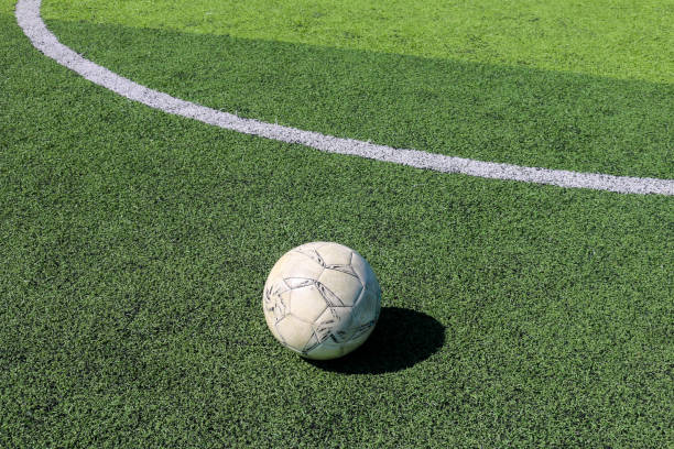 istock Football on artificial turf. It is for green background in a stadium 1069124168