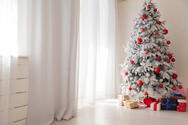 istock Christmas presents new year holidays Christmas tree red white 1069128742
