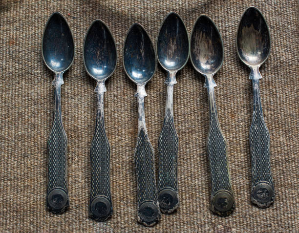 istock Stylish steel teaspoons on a textured background 1069131922