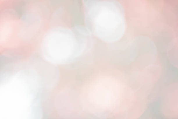 Abstract Bokeh with soft blurred background nature blurry light party in vintage style warm pastel shimmering and faded cool colorful defocused circular. Shiny copy space for holiday card.